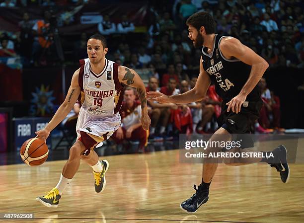 Argentina's small forward Patricio Garino marks Venezuela's point guard Heissler Guillent during their 2015 FIBA Americas Championship Men's Olympic...