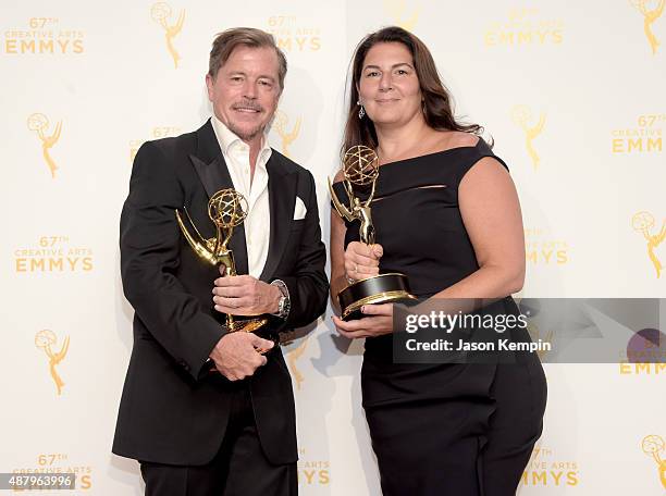 Howard Cummings and Regina Graves, winners of the award for outstanding production design for a narrative period program for "The Knick," pose in the...