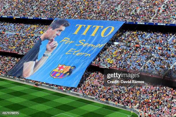 Barcelona fans display a huge banner in memory of former FC Barcelona head coach Tito Vilanova prior to the La Liga match between FC Barcelona and...