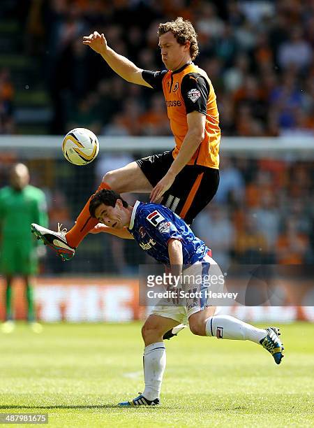 Kevin McDonald of Wolves out-jumps Danny Redmond of Carlisle during the Sky Bet League One match between Wolverhampton Wanderers and Carlisle United...