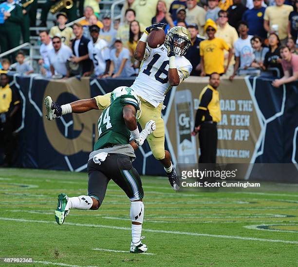 TaQuon Marshall of the Georgia Tech Yellow Jackets makes a catch for a touchdown against Malik Eugene of the Tulane Green Wave on September 12, 2015...
