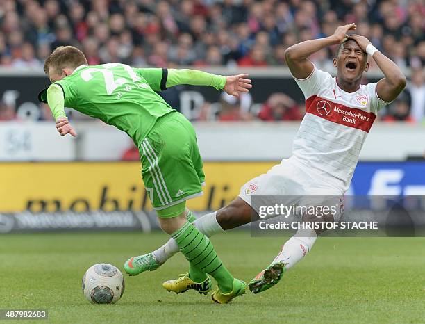 Wolfsburg's midfielder Maximilian Arnold and Stuttgart's Ecuadorian midfielder Carlos Gruezo vie for the ball during the German first division...