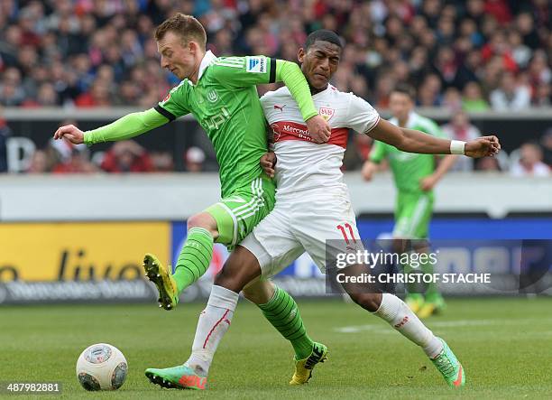 Wolfsburg's midfielder Maximilian Arnold and Stuttgart's Ecuadorian midfielder Carlos Gruezo vie for the ball during the German first division...