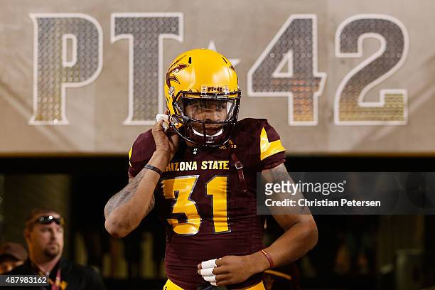 Safety Marcus Ball of the Arizona State Sun Devils takes the field before the college football game against the Cal Poly Mustangs at Sun Devil...