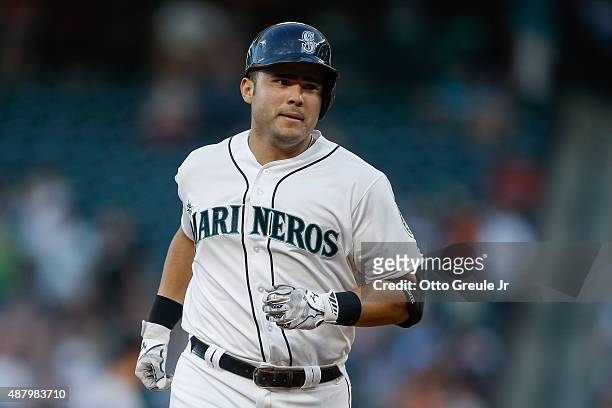 Jesus Montero of the Seattle Mariners rounds the bases after hitting a solo home run in the fourth inning against the Colorado Rockies at Safeco...