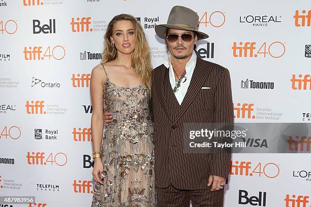 Amber Heard and Johnny Depp attend the premiere of "The Danish Girl" at Princess of Wales Theatre during the 2015 Toronto International Film Festival...