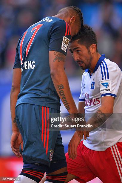 Jerome Boateng of Munechen head butts Kerem Demirbay of Hamburg during the Bundesliga match between Hamburger SV and FC Bayern Muenchen at Imtech...