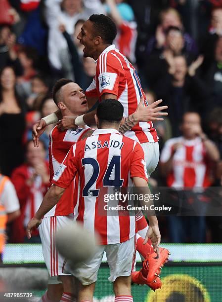 Marko Arnautovic of Stoke City celebrates with team mates Steven N�Zonzi and Oussama Assaidi after scoring his sides third goal during the Barclays...