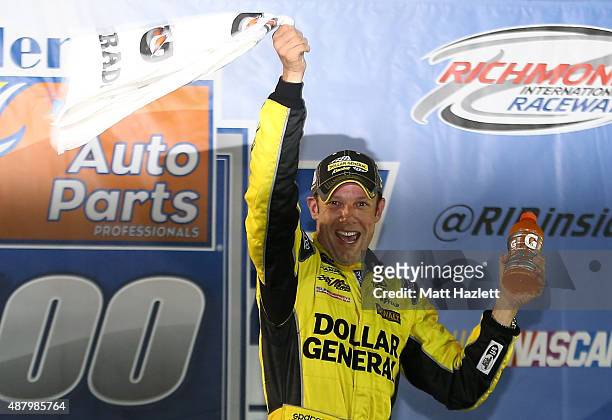 Matt Kenseth, driver of the Dollar General Toyota, celebrates in Victory Lane after winning the NASCAR Sprint Cup Series Federated Auto Parts 400 at...