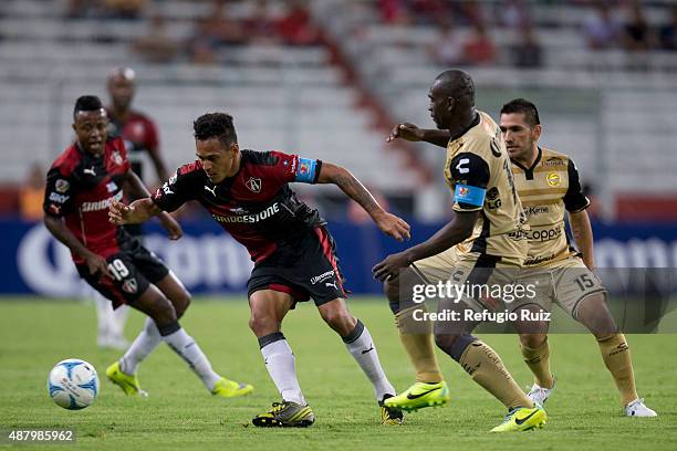 Aldo Ramirez of Atlas fights for the ball with Segundo Castillo of Dorados during an 8th round match between Atlas and Dorados de Sinaloa as part of...