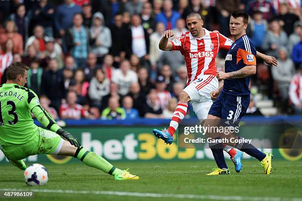 Jonathan Walters of Stoke City shoots and scores his sides fourth goal past David Stockdale the Fulham goalkeeper during the Barclays Premier League...