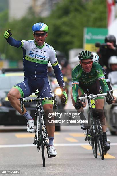 Mchael Albasini of Switzerland and Orica GreenEdge celebrates victory from Thomas Voeckler of France and Team Europcar during stage four of the Tour...