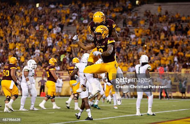 Wide receiver D.J. Foster of the Arizona State Sun Devils celebrates with Gary Chambers after Foster caught a 14 yard touchdown reception against the...