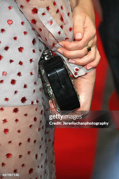 Actor Emily Browning, clutch detail, attends the "Legend" premiere during the 2015 Toronto International Film Festival held at Roy Thomson Hall on...