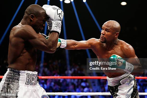 Floyd Mayweather Jr. Throws a right at Andre Berto during their WBC/WBA welterweight title fight at MGM Grand Garden Arena on September 12, 2015 in...