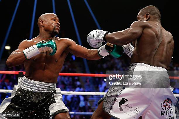 Floyd Mayweather Jr. Throws a left at Andre Berto during their WBC/WBA welterweight title fight at MGM Grand Garden Arena on September 12, 2015 in...