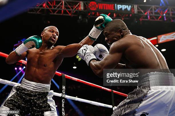 Floyd Mayweather Jr. Throws a left at Andre Berto during their WBC/WBA welterweight title fight at MGM Grand Garden Arena on September 12, 2015 in...