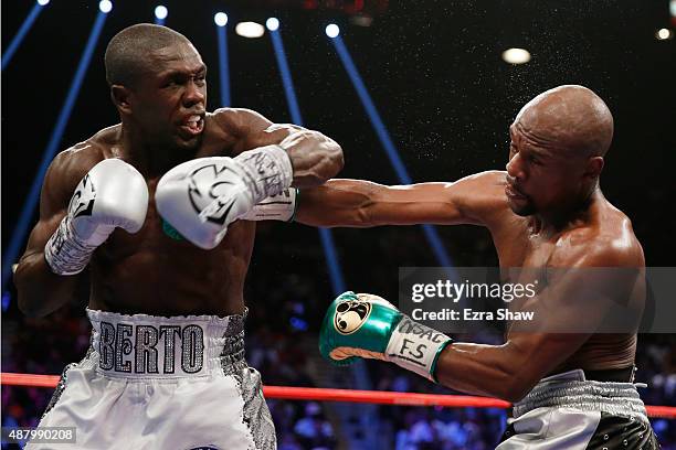 Andre Berto throws a left at Floyd Mayweather Jr. During their WBC/WBA welterweight title fight at MGM Grand Garden Arena on September 12, 2015 in...