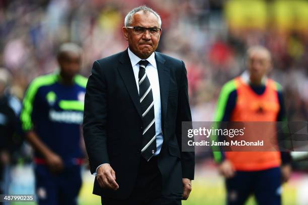 Fulham manager Felix Magath reacts as his side are relegated following their defeat in the Barclays Premier League match between Stoke City and...