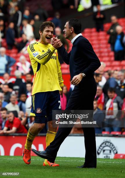 Marcos Alonso of Sunderland and Gustavo Poyet the Sunderland manager celebrate their eam's 1-0 victory during the Barclays Premier League match...