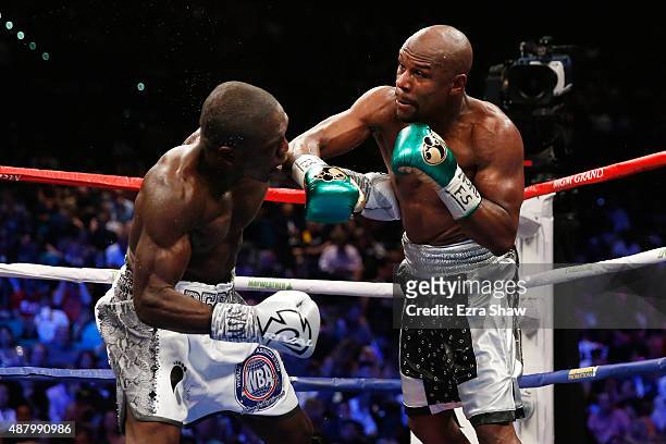 Floyd Mayweather Jr. Throws a right at Andre Berto during their WBC/WBA welterweight title fight at MGM Grand Garden Arena on September 12, 2015 in...