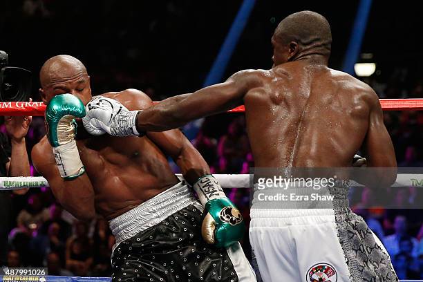 Andre Berto lands a left on Floyd Mayweather Jr. During their WBC/WBA welterweight title fight at MGM Grand Garden Arena on September 12, 2015 in Las...