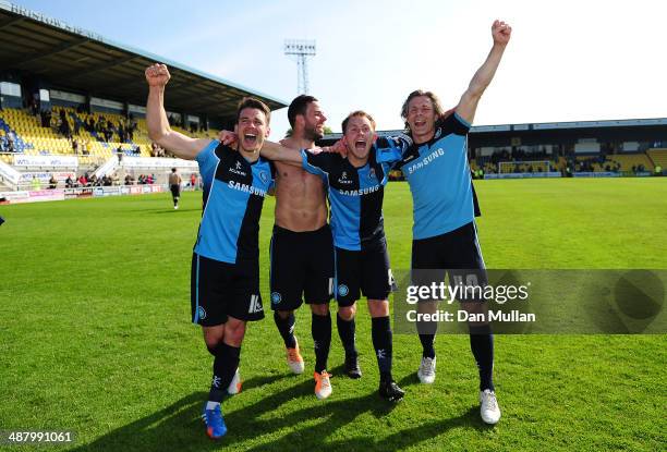 Matthew Bloomfield, Sam Wood, Stuart Lewis and Gareth Ainsworth, Manager of Wycombe Wanderers celebrate after the final whistle as their team avoid...