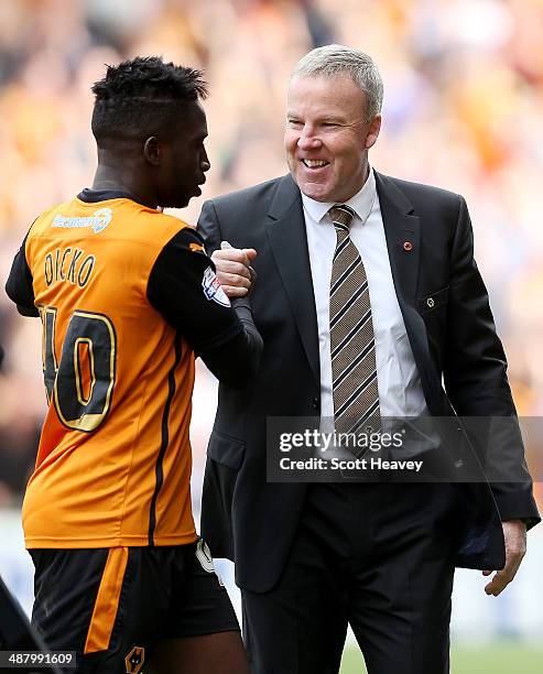 Wolves manager Kenny Jackett with Nouha Dicko during the Sky Bet League One match between Wolverhampton Wanderers and Carlisle United at Molineux on...