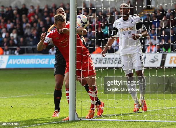 Rickie Lambert of Southampton beats Michel Vorm and Ashley Williams of Swansea City to score their first goal during the Barclays Premier League...