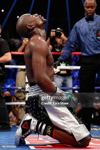 Floyd Mayweather Jr. Kneels on the mat after winning his WBC/WBA welterweight title fight against Andre Berto at MGM Grand Garden Arena on September...