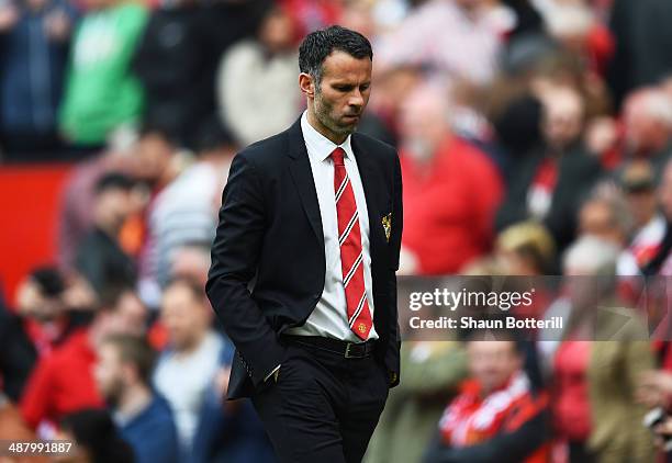 Dejected Ryan Giggs the Manchester United interim manager walks off the pitch following his team's 1-0 defeat during the Barclays Premier League...