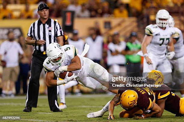 Running back Joe Protheroe of the Cal Poly Mustangs dives forward as he rushes the football against the Arizona State Sun Devils during the second...