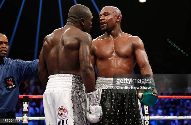 Floyd Mayweather Jr. And Andre Berto exchange words in the middle of the ring during their WBC/WBA welterweight title fight at MGM Grand Garden Arena...