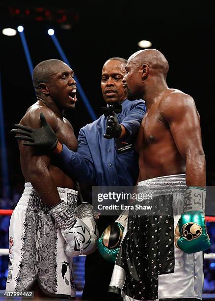 Floyd Mayweather Jr. And Andre Berto exchange words in the middle of the ring during their WBC/WBA welterweight title fight at MGM Grand Garden Arena...