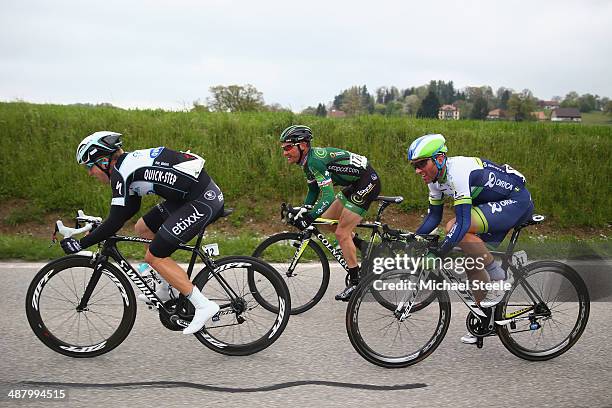 Jan Bakelants of Belgium and Omega Pharma-Quick Step sets the pace in a breakaway group followed byThomas Voeckler of France and Team Europcar and...