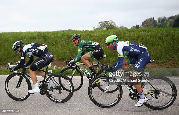 Jan Bakelants of Belgium and Omega Pharma-Quick Step sets the pace in a breakaway group followed byThomas Voeckler of France and Team Europcar and...