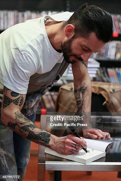 The Italian rapper and songwriter Francesco Tarducci, also known as "Nesli", signs autograph of his first novel titled "Andrà tutto bene". At...