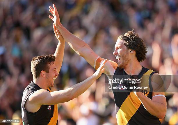 Tyrone Vickery of the Tigers is congratulated by Kane Lambert after kicking a goal during the First AFL Elimination Final match between the Richmond...