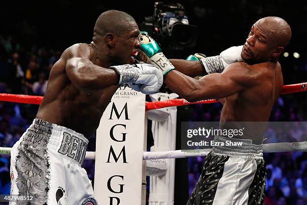 Floyd Mayweather Jr. And Andre Berto trade punches during their WBC/WBA welterweight title fight at MGM Grand Garden Arena on September 12, 2015 in...