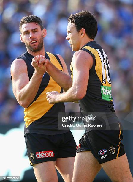 Chris Newman and Shane Edwards of the Tigers celebrate a goal during the First AFL Elimination Final match between the Richmond Tigers and the North...