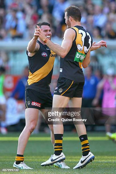 Chris Newman and Kamdyn McIntosh of the Tigers celebrate a goal during the First AFL Elimination Final match between the Richmond Tigers and the...