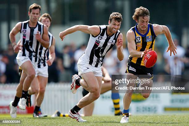 Josh Saunders of Sandringham runs with the ball during the VFL Semi Final match between Sandringham and Collingwood at North Port Oval on September...