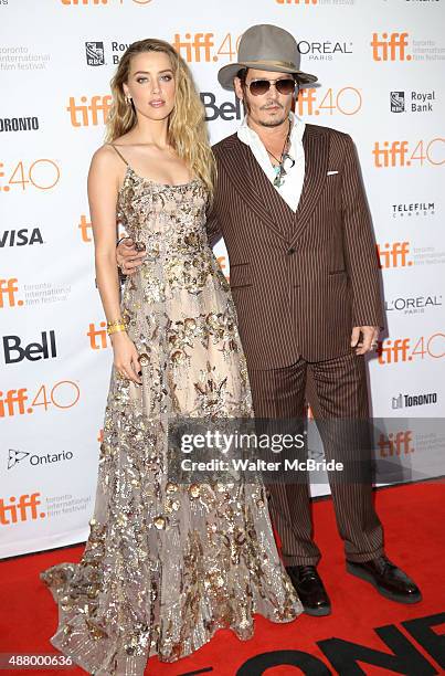 Amber Heard and Johnny Depp attend the premiere of 'The Danish Girl' at Princess of Wales Theatre during the 2015 Toronto International Film Festival...