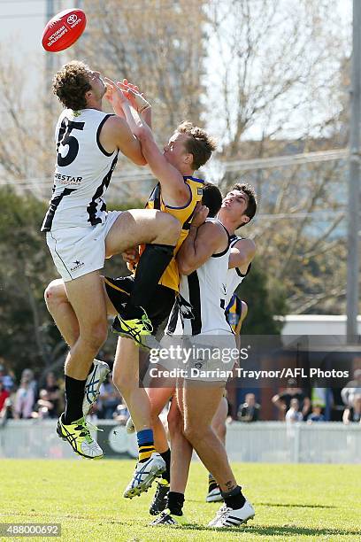 Jarrod Witts of Collingwood jumops into Daniel Markworth of Sandringham during the VFL Semi Final match between Sandringham and Collingwood at North...