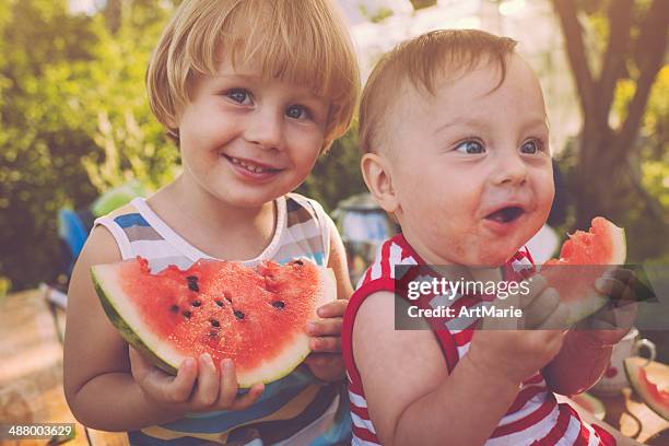 children with watermelon - watermelon picnic stock pictures, royalty-free photos & images