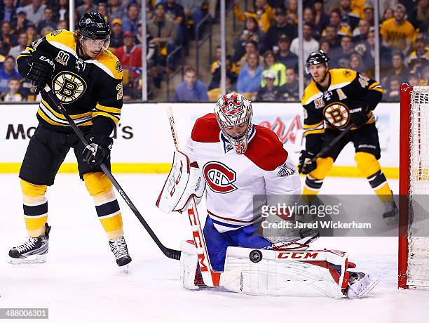 Carey Price of the Montreal Canadiens makes a save in front of Loui Eriksson of the Boston Bruins in the first period in Game Two of the Second Round...