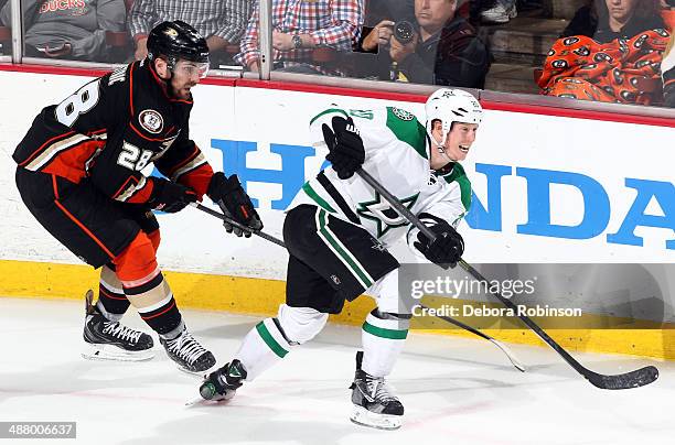 Cody Eakin of the Dallas Stars handles the puck against Mark Fistric of the Anaheim Ducks in Game Five of the First Round of the 2014 Stanley Cup...