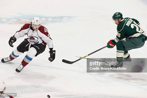 Matt Moulson of the Minnesota Wild slashes Nathan MacKinnon of the Colorado Avalanche during Game Six of the First Round of the 2014 Stanley Cup...