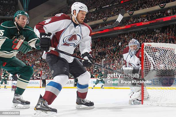 Ryan Wilson of the Colorado Avalanche and Dany Heatley of the Minnesota Wild skate to the puck during Game Six of the First Round of the 2014 Stanley...