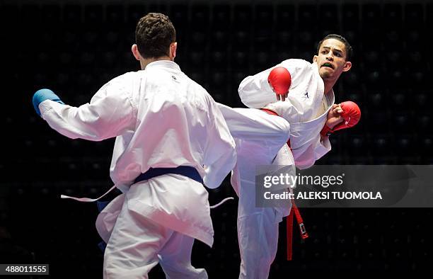 England's Jordan Thomas fights with Niyazi Aliyev of Azerbaijan during the men's Kumite -67 kg competition of the Karate European Champions on May 3,...